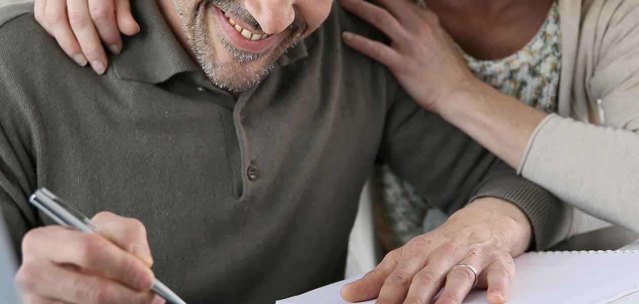 Couple signing off their bank statement loans